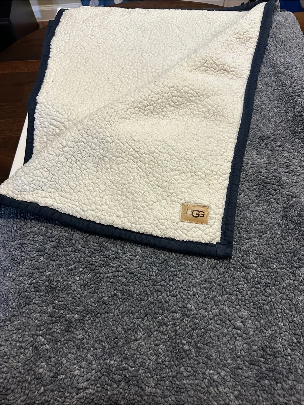 UGG Cream/Navy Sherpa Throw with Tan Logo Patch